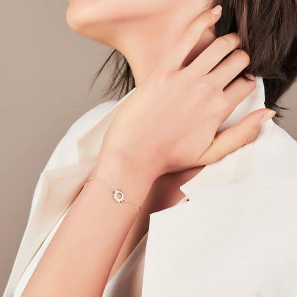 Model wearing silver sunrays bracelet