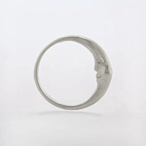 Sterling silver ring with hidden crescent moon inside and engraved star details, handmade by Manom Jewellery