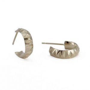 Sterling silver faceted hoops with a textured design, by Rosie Kent