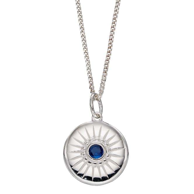 Sterling silver disc pendant with a blue crystal and engraved line details
