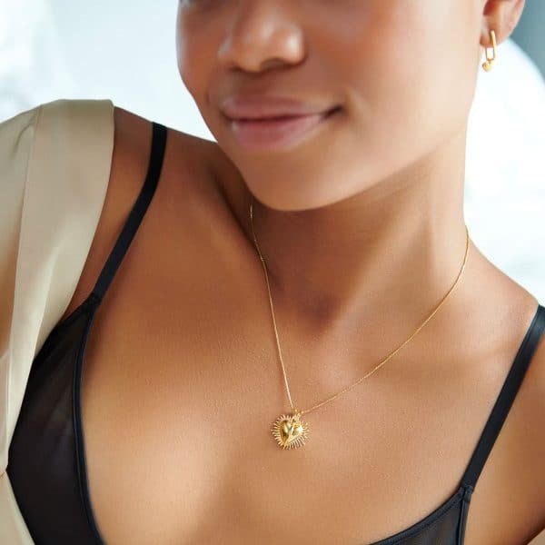 Model wearing rachel jackson gold heart necklace