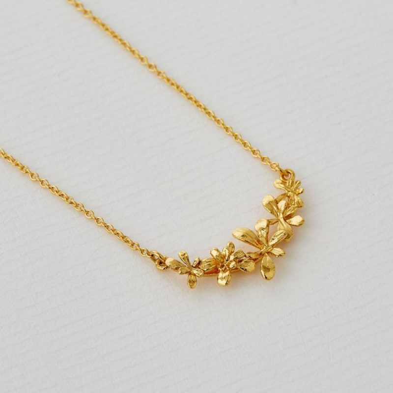 Gold sprouting flower necklace from alex monroe