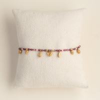 Pink Beaded Bracelet with Tiny Charms and Pearl Detail. AMIE, Paris