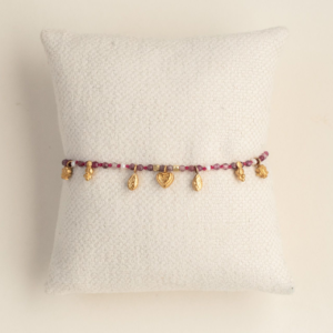 Pink Beaded Bracelet with Tiny Charms and Pearl Detail. AMIE, Paris