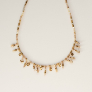Beaded Necklace with Dangling Charm Details. AMIE, Paris